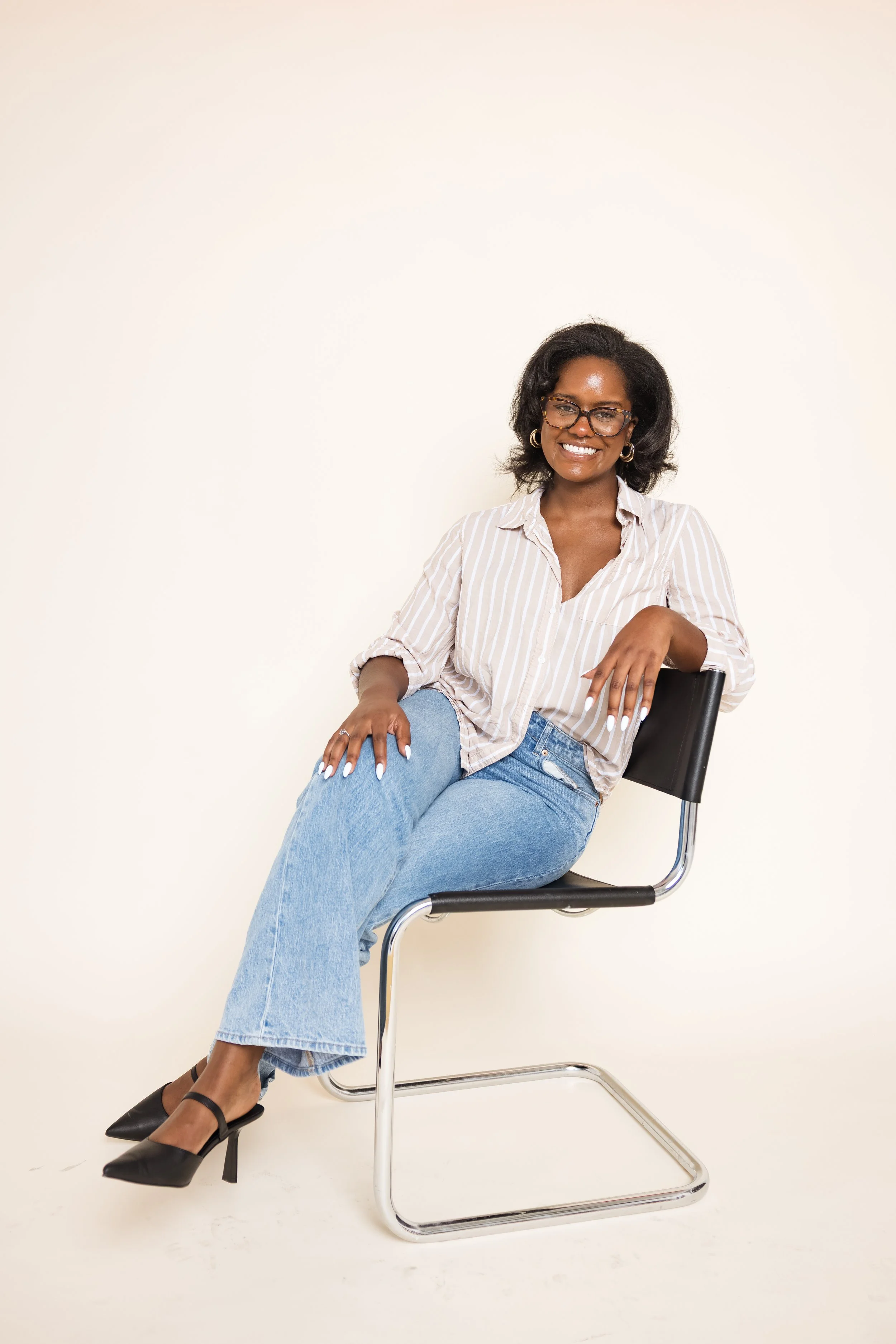 Peyton Sutton, sports mental health presenter, seated in a professional portrait