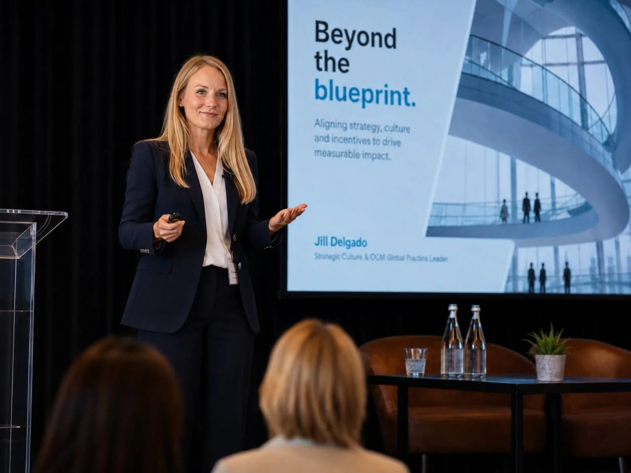 Jill Delgado delivering a keynote presentation on stage