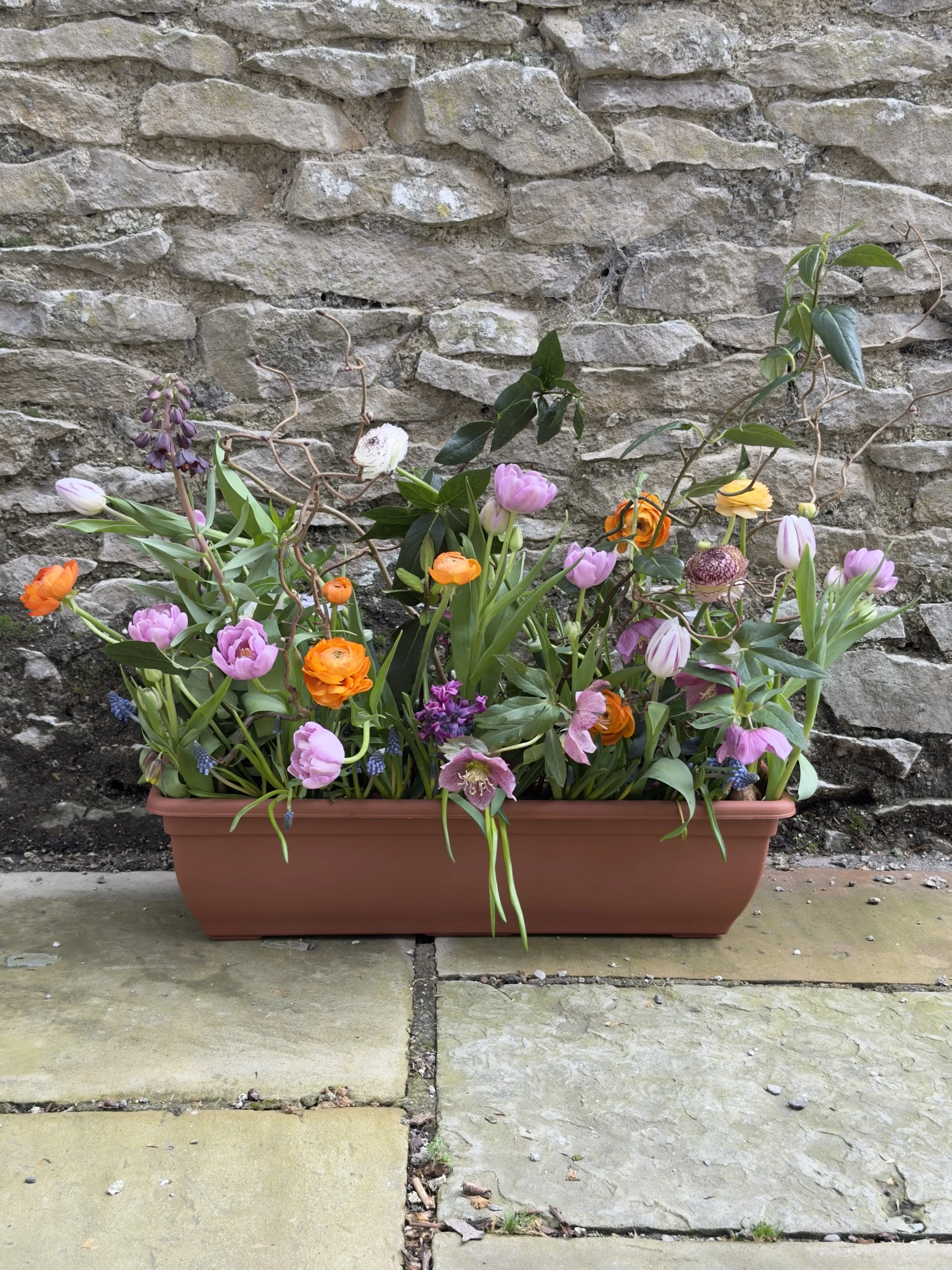 A meadow box full of beautiful British grown flowers. Soft movement, seasonal stems and that just-gathered feel for a romantic Shropshire wedding.