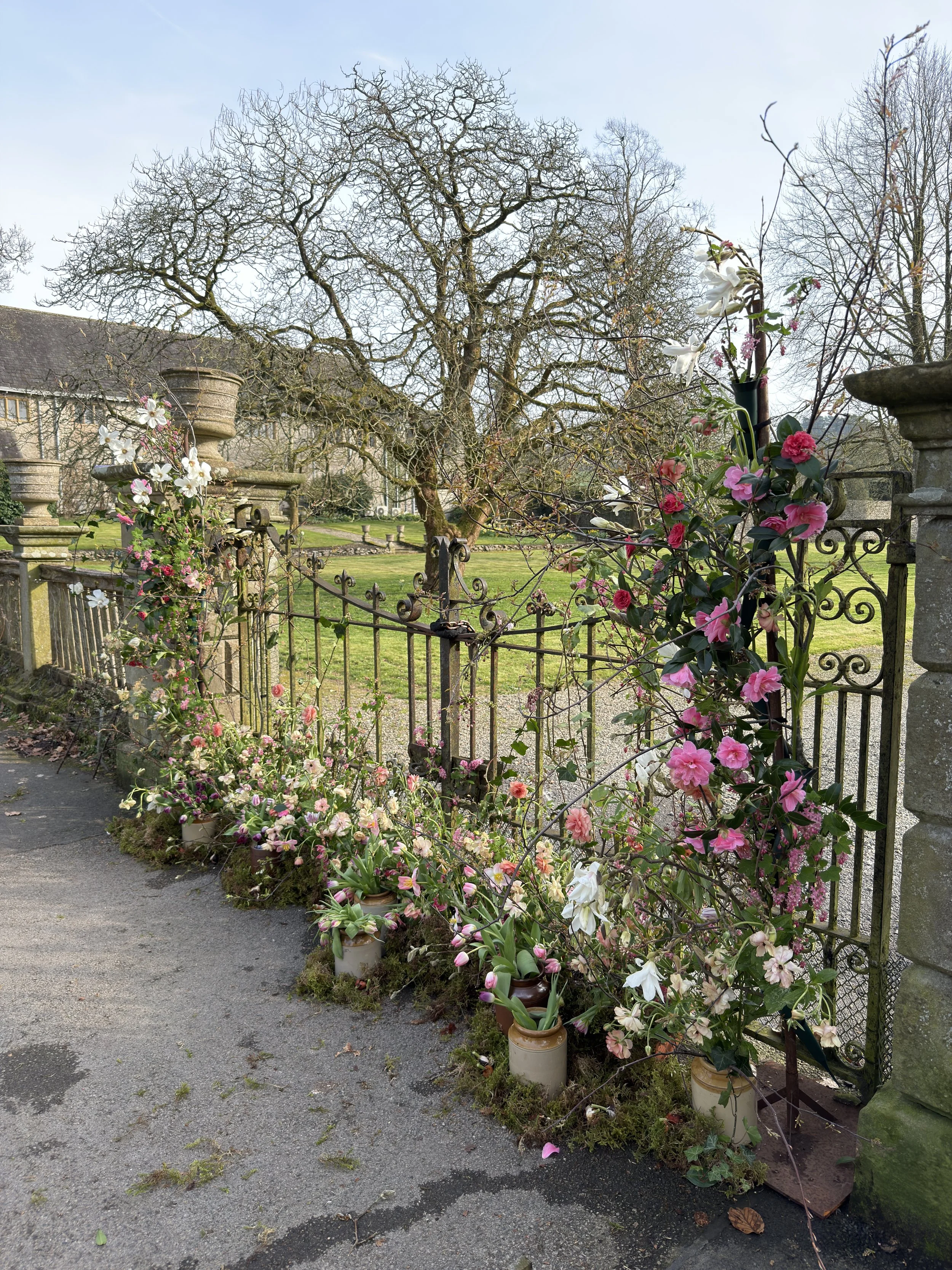 A broken floral wedding arch displaying spring florals. Beautifully wild and romantic florals in a meadowbox, which would also compliment an aisle for wedding ceremonies.