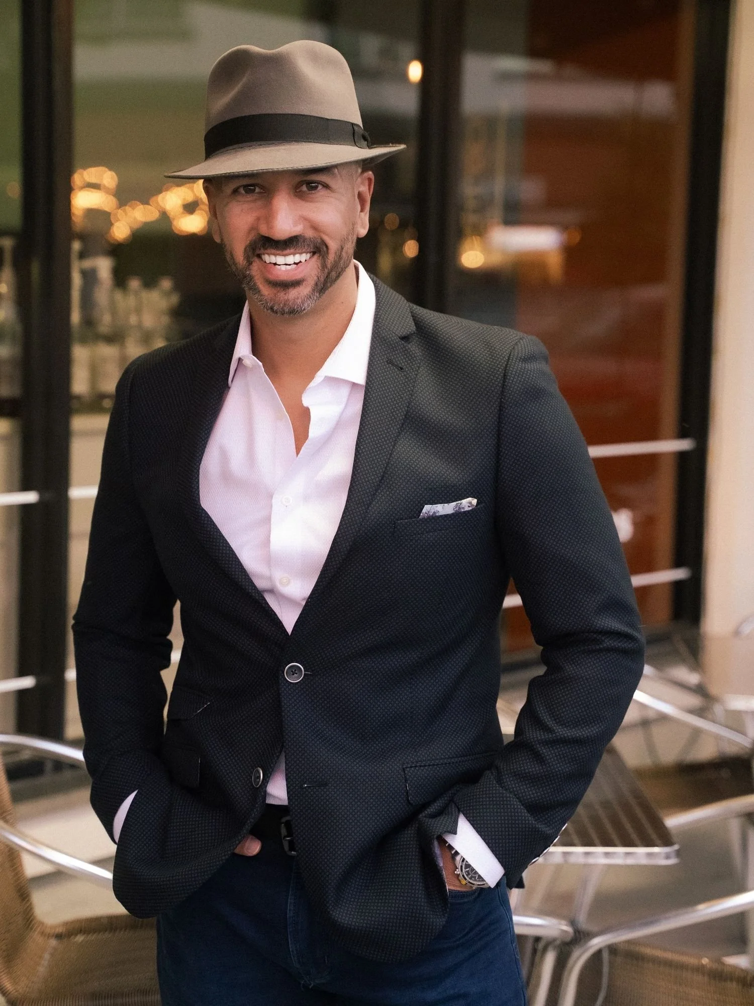 Dave DeLaRosa professional voice actor portrait in hat and blazer