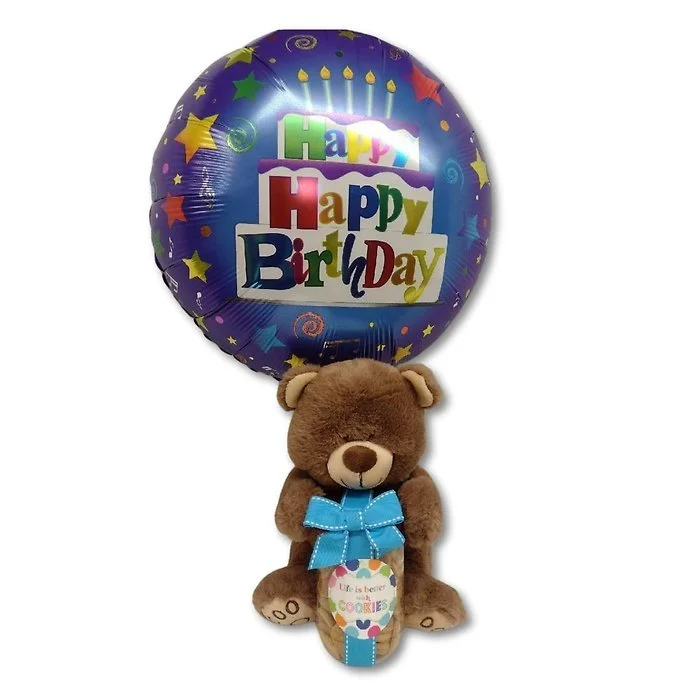 Balloon with a birthday message, and a teddy bear with a blue bow tie and a small hanging tag.