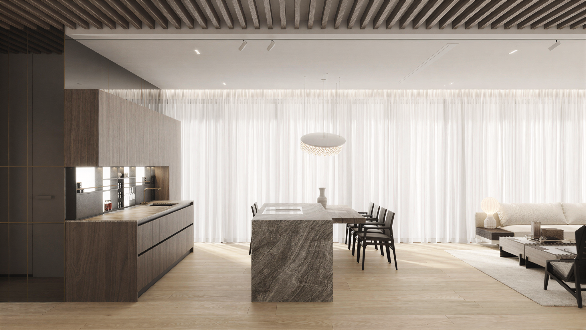 Modern, minimalist living space with a kitchen area featuring wooden cabinetry, a marble island, and bar stools, along with a sitting area with a white sofa, black armchairs, and a coffee table, illuminated by natural light through large sheer curtai