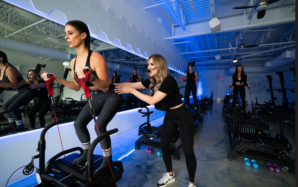 Two Persona instructors coaching a class in the studio