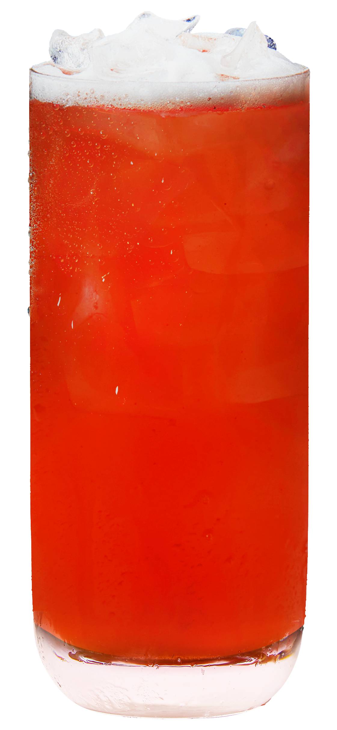A glass filled with an amber-colored beverage topped with whipped cream and ice cubes.