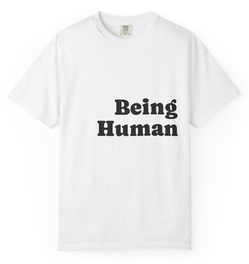 White T-shirt with bold black text that reads "Being Human".
