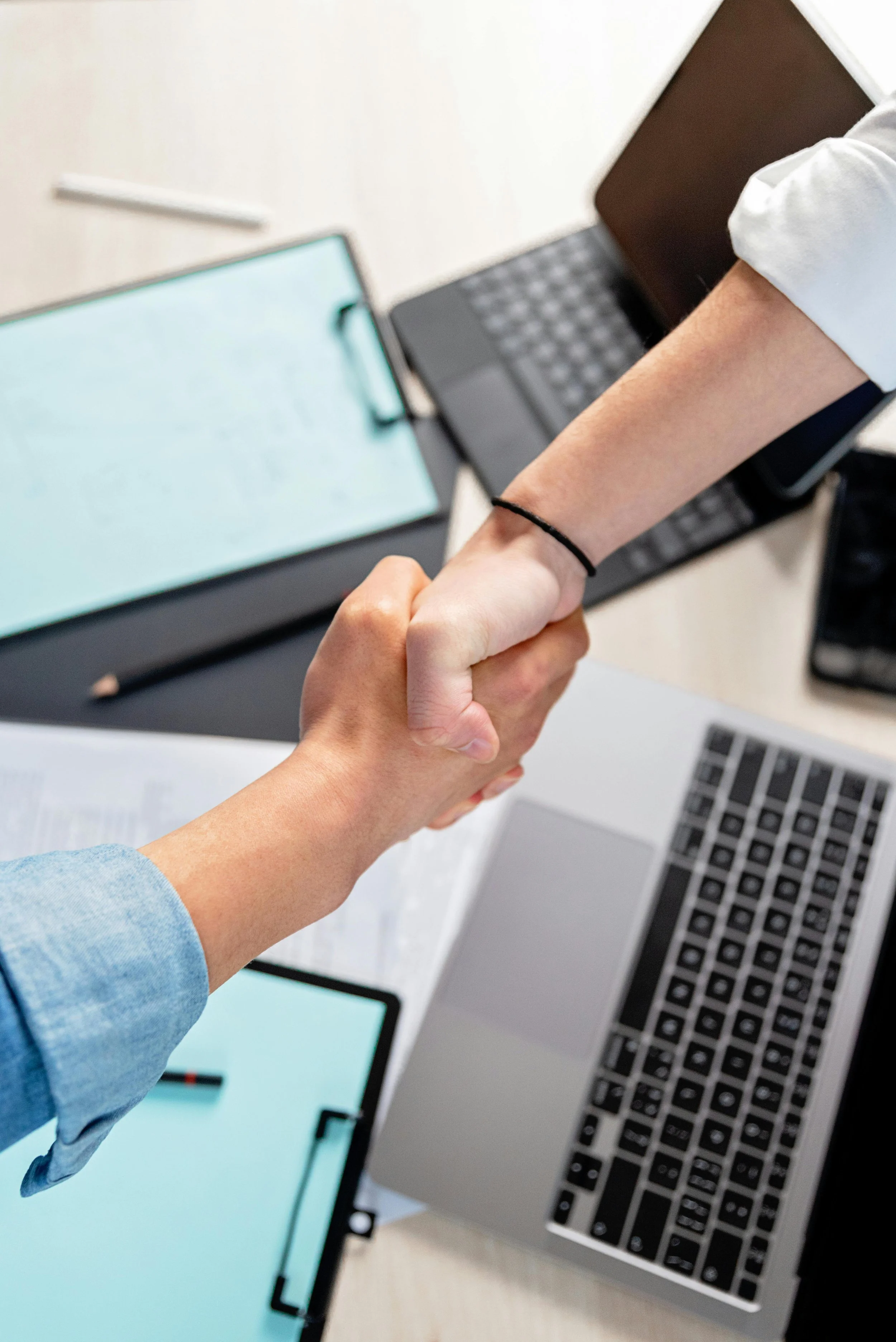 Hands shaking to accept help from severance law pllc