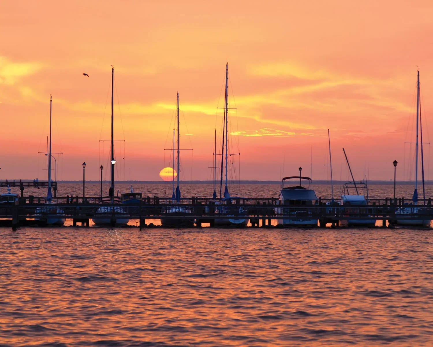 The sunset over the water, one of the many things to do in Fairhope, AL