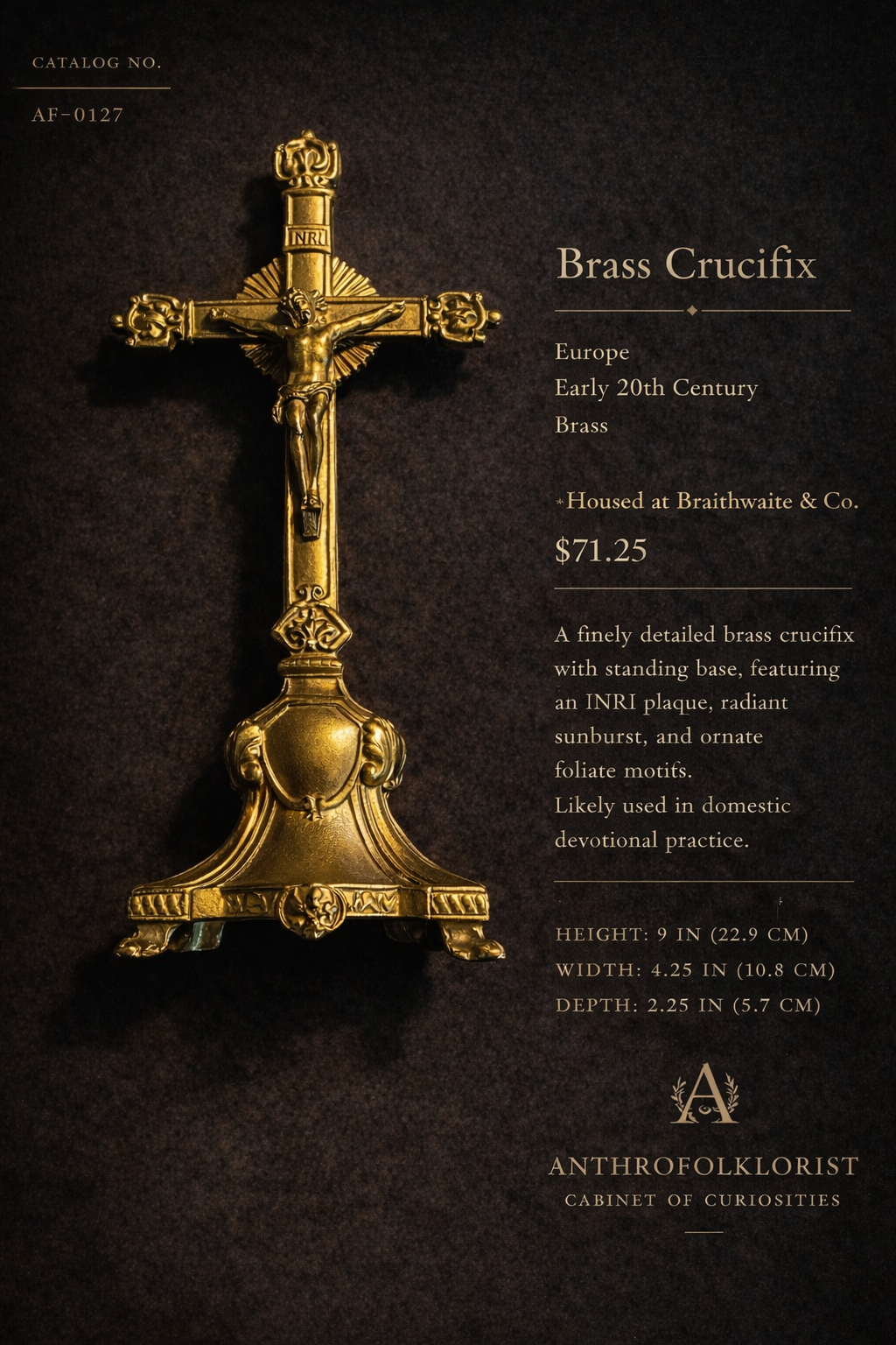 Gold brass crucifix with standing base, featuring a figure of Jesus Christ, radiating sunburst, and ornate foliate motifs. Displayed on a dark background with descriptive text.