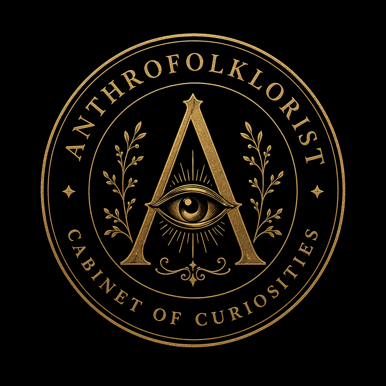 A circular emblem with the words 'An Encyclopedia of the Unknown' and 'Cabinet of Curiosities' in gold on a black background. The center features a large letter 'A' with an eye inside an eye with rays emanating from it, flanked by two branches.