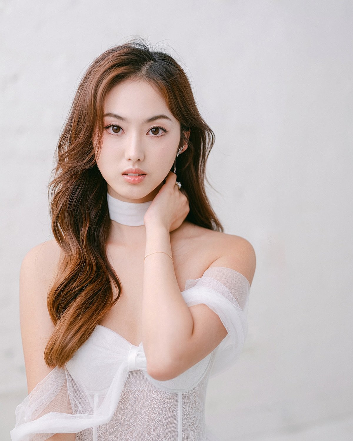 Soft glam perfection for this bridal editorial &mdash; flawless skin, accentuated eyes, and whimsical waves to bring this enchanting look to life.