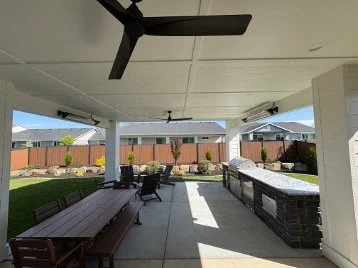 15 foot patio expansion with infrared heaters, full outdoor kitchen, lighting, and ceiling fan fans