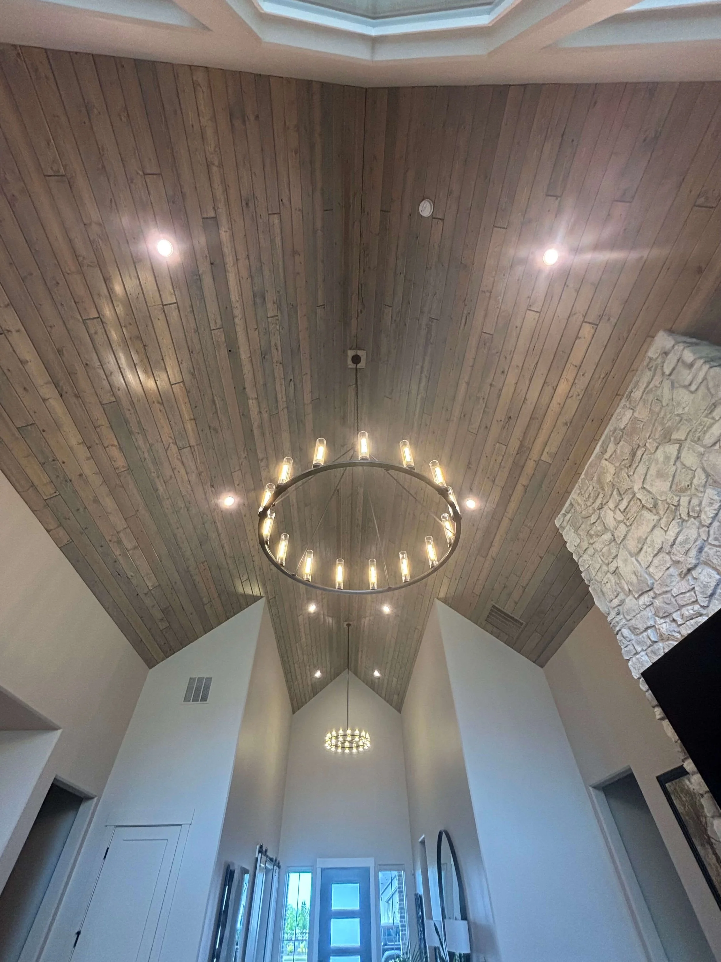Chandelier installed on custom tongue and groove ceiling