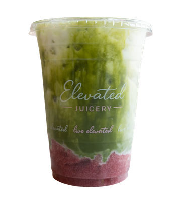 Glass of green matcha latte with ice cubes, featuring the Elevated Juicery logo.