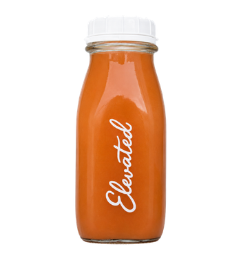 Bottle of Elevated juice with a white cap and orange liquid inside
