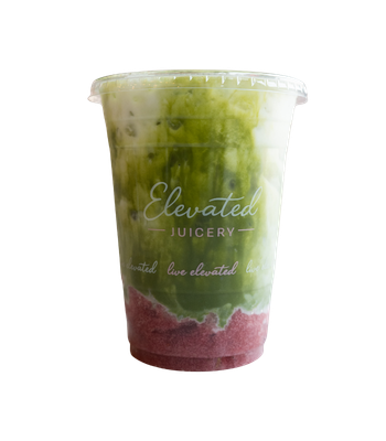 Green iced beverage in a branded plastic cup with ice cubes and a straw.