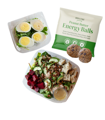 Four energy bites on a white plate