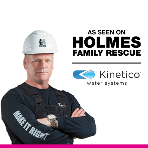 A construction worker wearing a white hard hat and black work overalls with arms crossed, standing in front of a colorful background with abstract shapes and a logo.