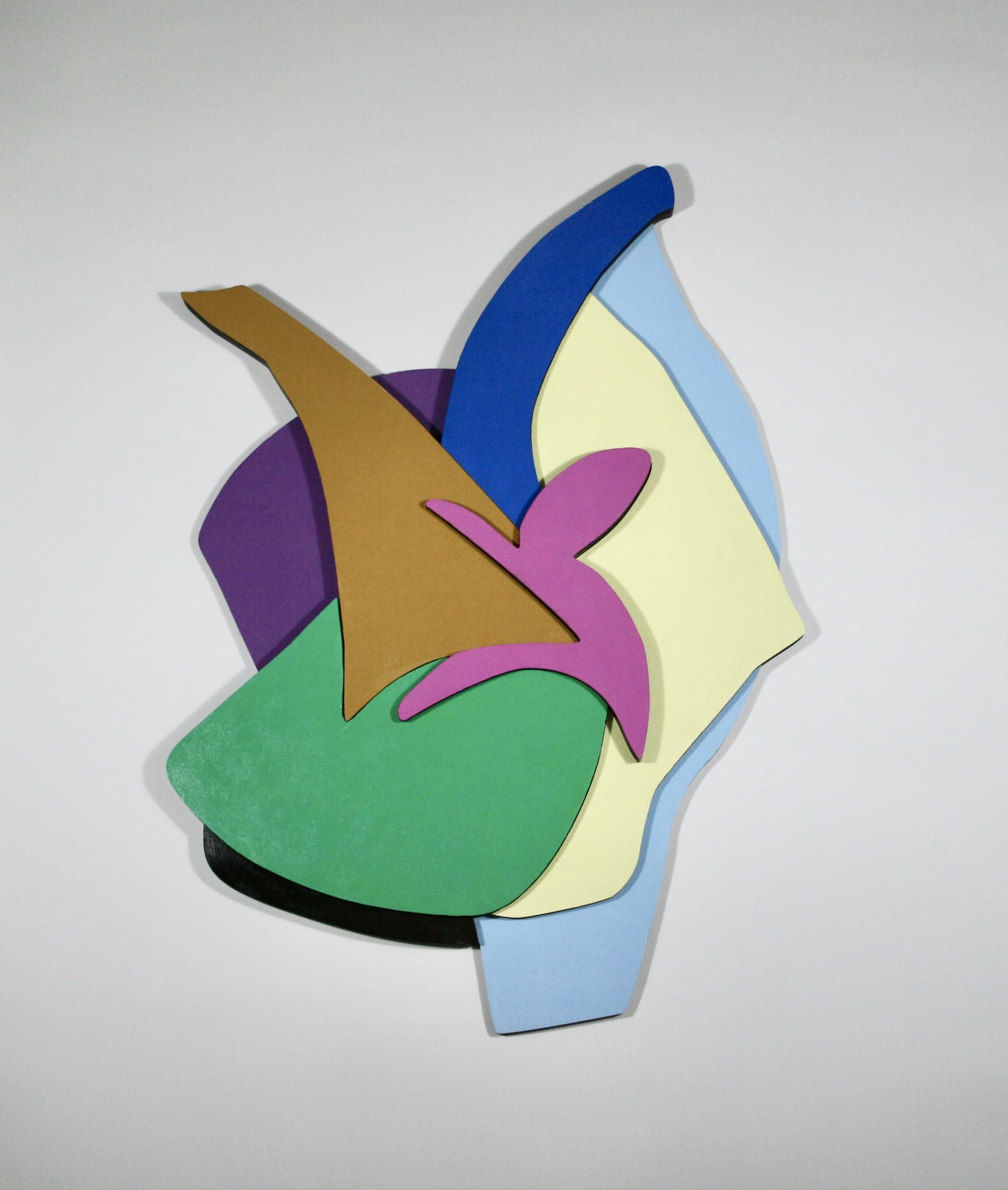 Colorful abstract sculpture with various overlapping shapes in purple, green, brown, pink, yellow, and blue on a white background.