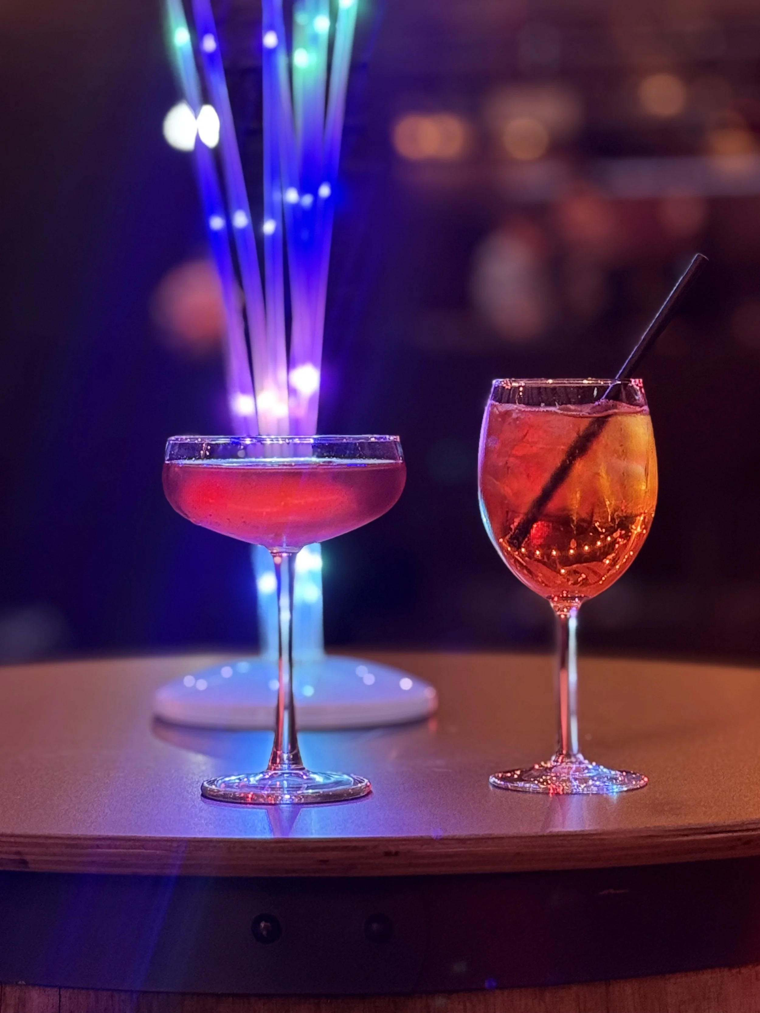 Cocktails on a lit bar table at a Warehouse 16 event