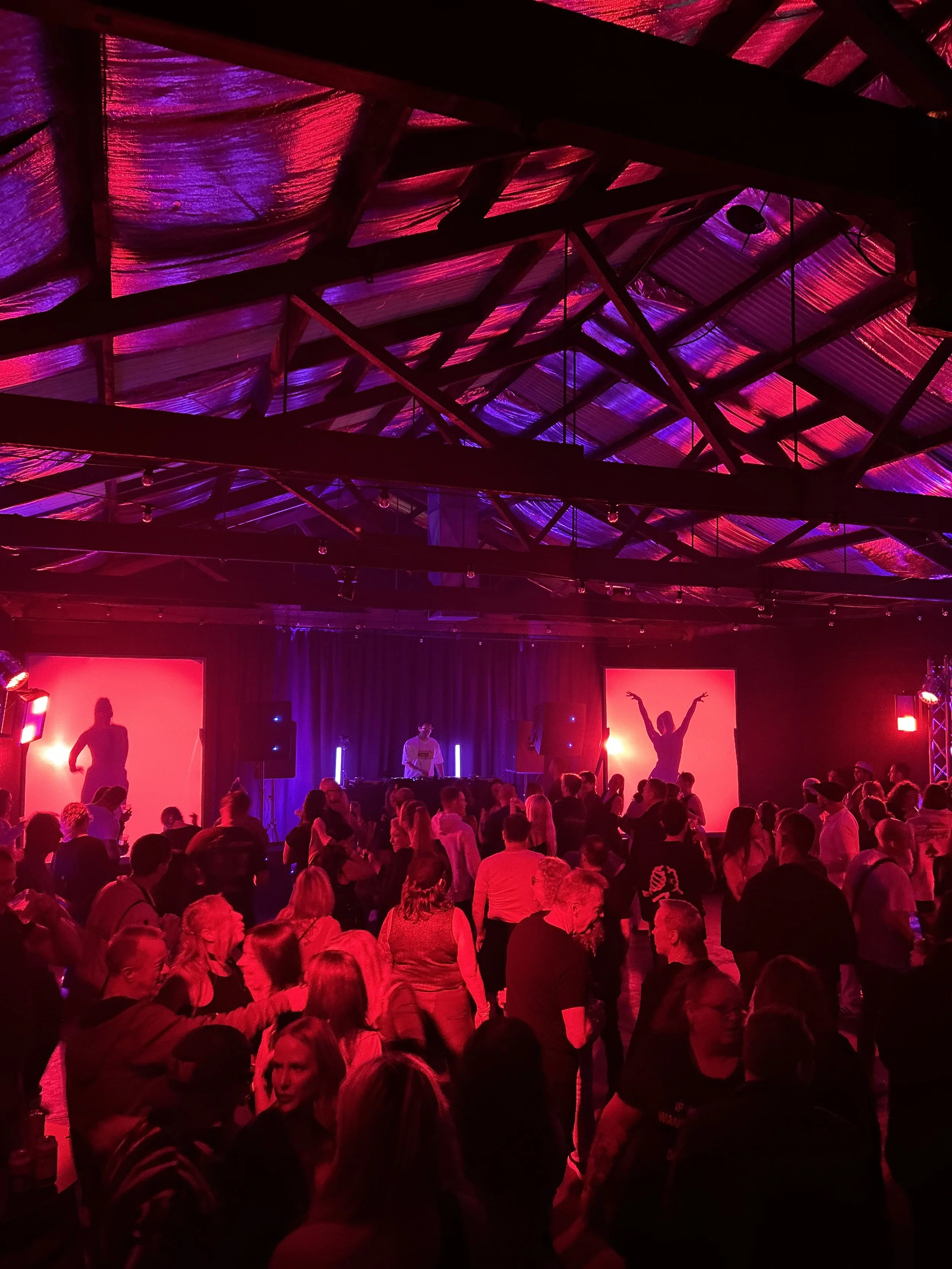 Crowd with hands up at a live music night at Warehouse 16