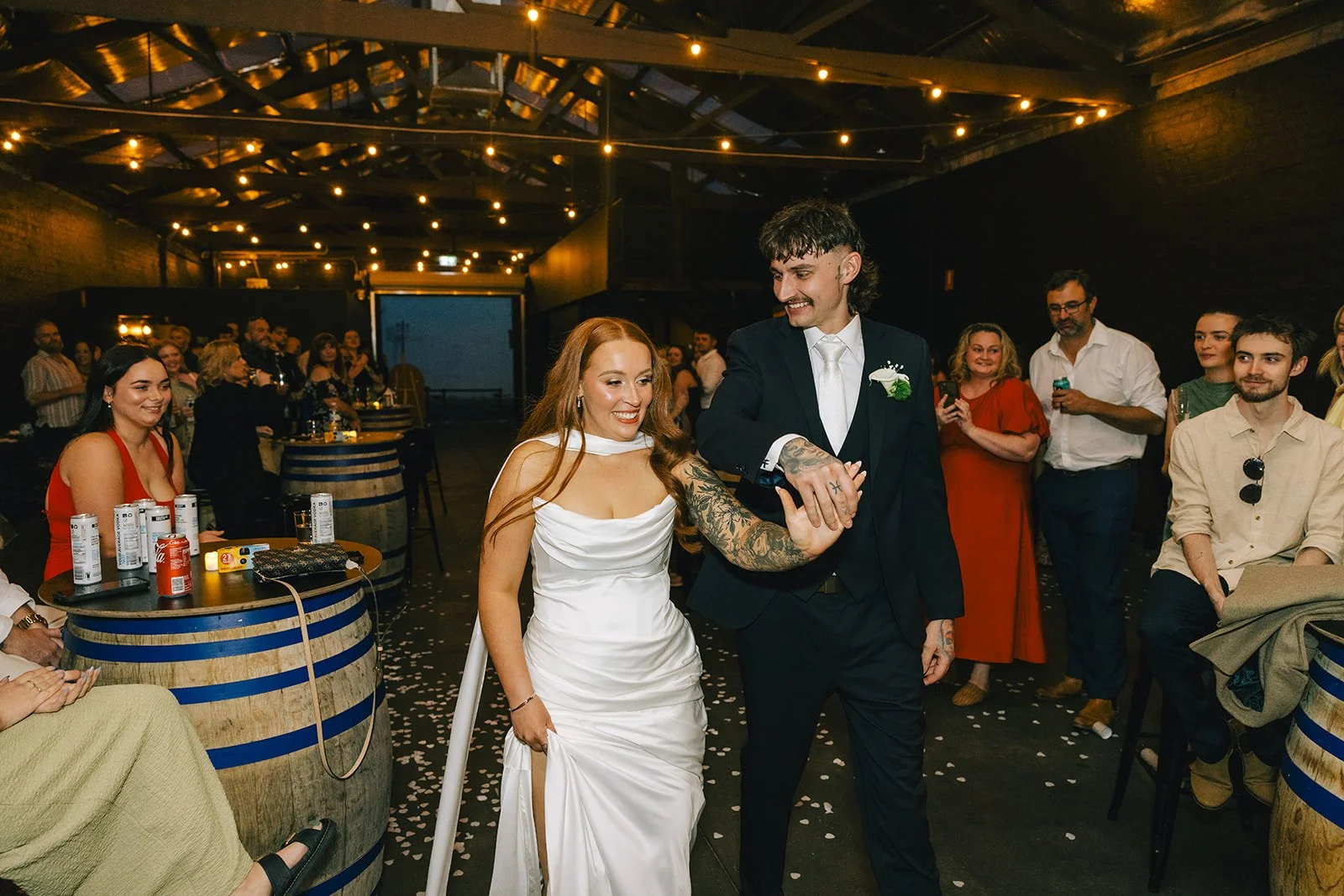 Bride and groom make their entrance at a Warehouse 16 wedding reception