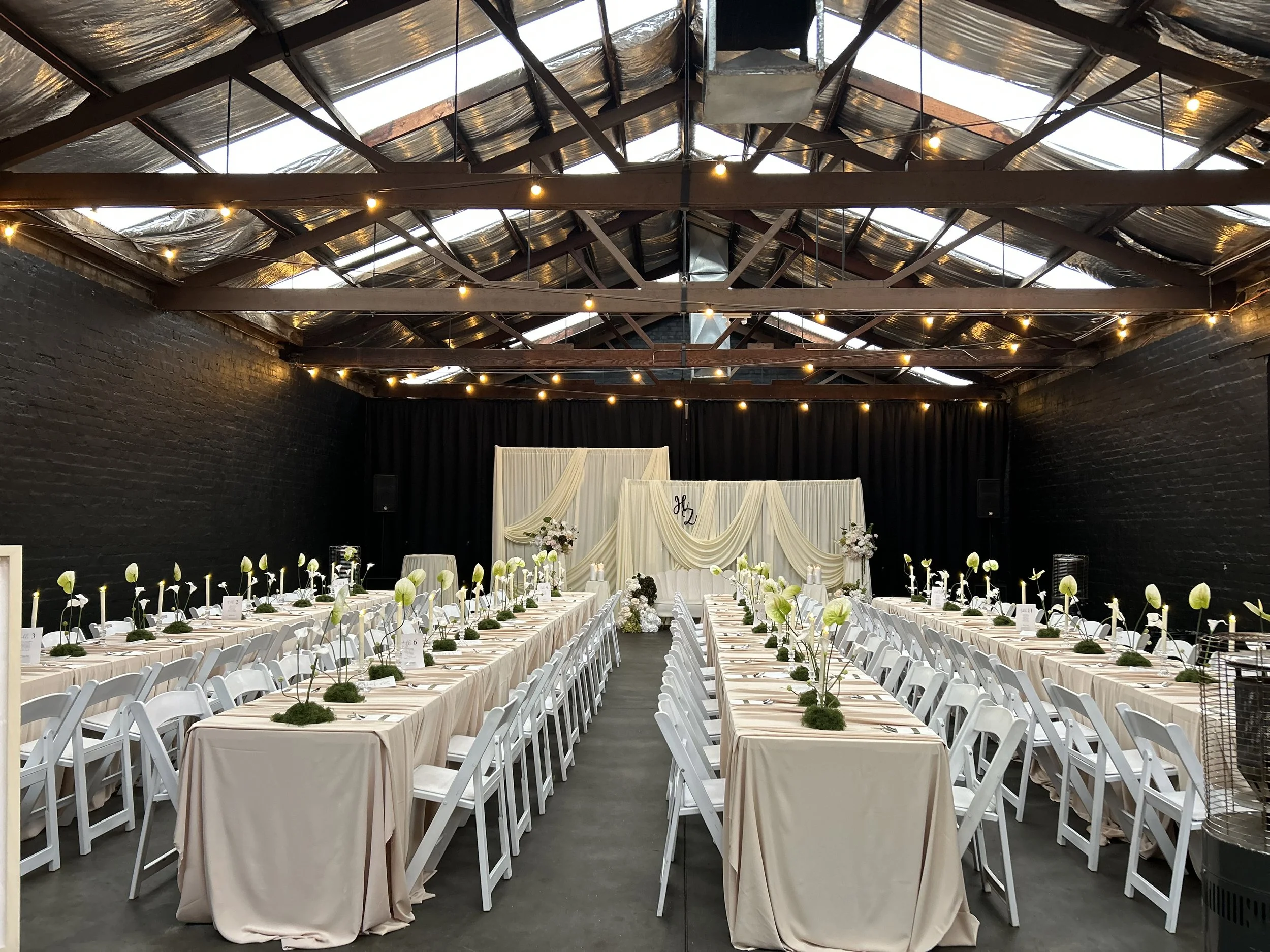 Long tables set for a wedding reception at Warehouse 16, Adelaide