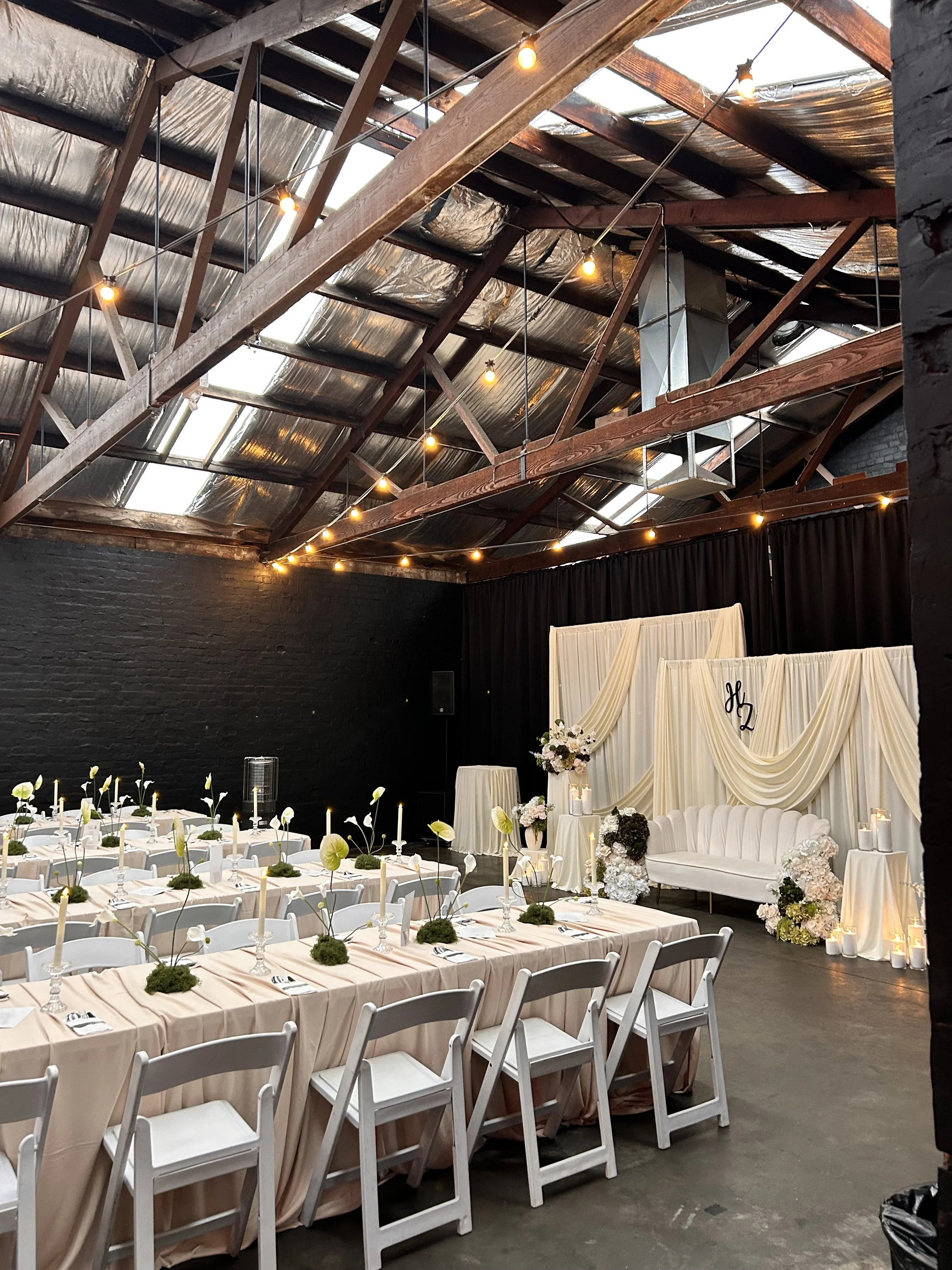 Warehouse 16 set with long tables for a seated function, Adelaide