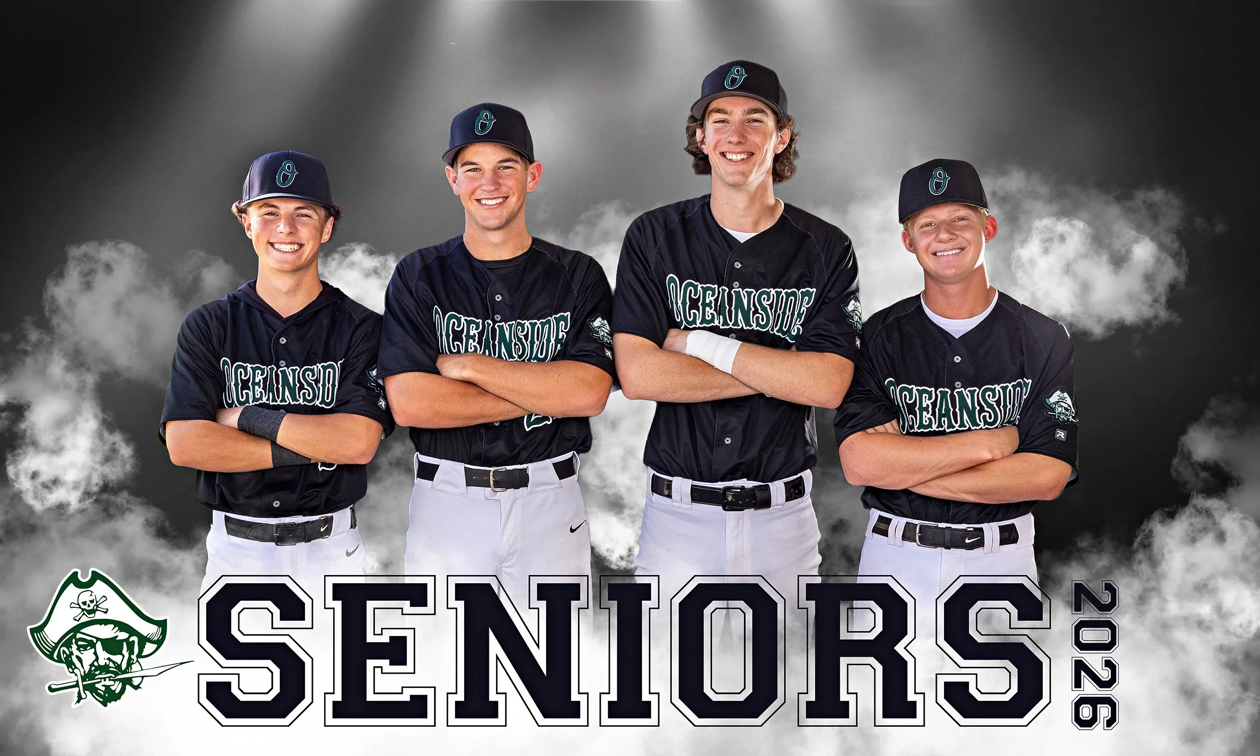 Four young baseball players in black jerseys and white pants, wearing baseball caps with a blue logo, stand with arms crossed in front of a cloudy background. The jerseys have the word 'OCEANSIDE' written on them, and there is a pirate logo at the bo