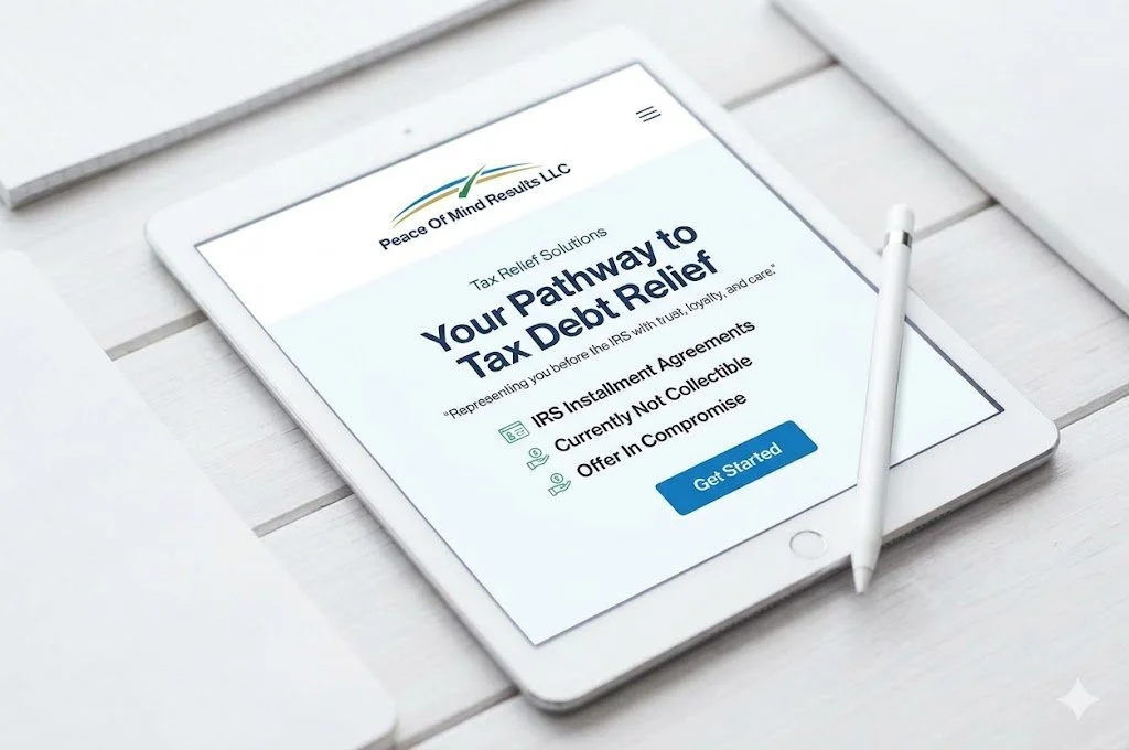 A tablet displaying a website for tax debt relief services on a white table with a stylus pen beside it.