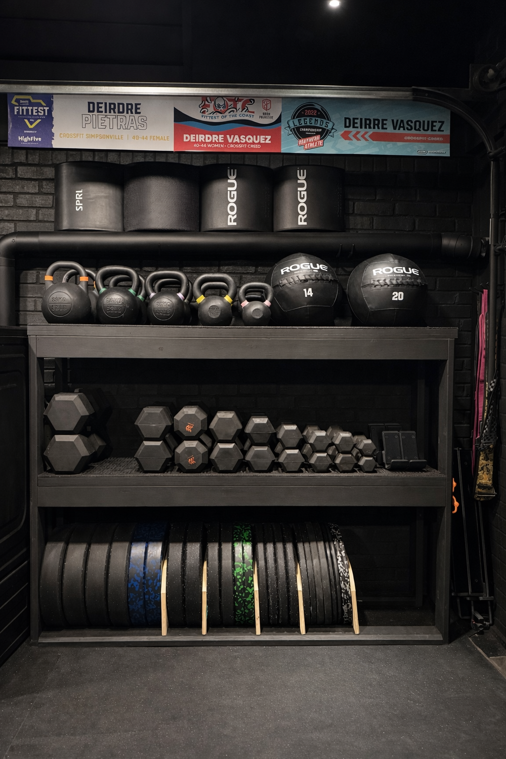 45-35-25-15-10 pound bumper plates as well as  5 and 2.5 pound change plates. Dumbbell sets of 70-50-40-35-30-25-15-10-5 pounds. Kettlebell sets of 62-53-44-35-18-10 pounds as well as Abmats. 20 and 14 pound wall balls.