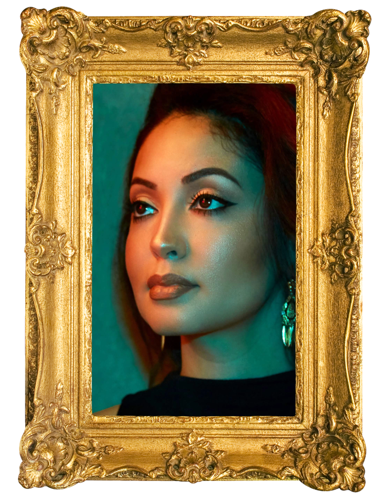 Portrait of a woman with makeup, earrings, and dark hair, framed by an ornate gold frame.