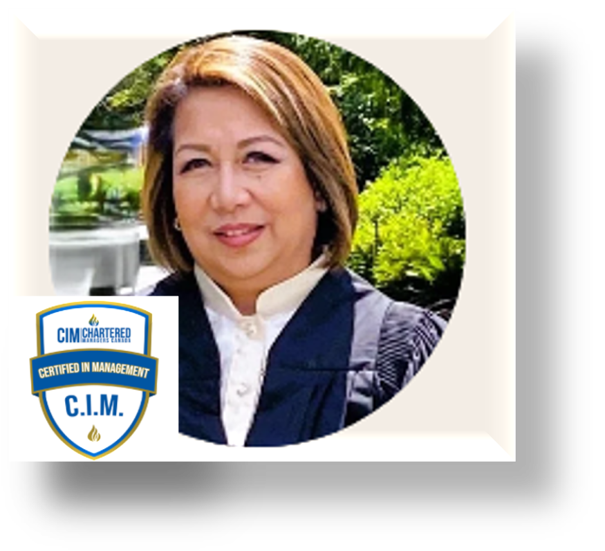 A woman with shoulder-length brown hair wearing a dark blazer and white shirt, outdoors with green foliage in the background, accompanied by a CIM Chartered Managers Award badge.