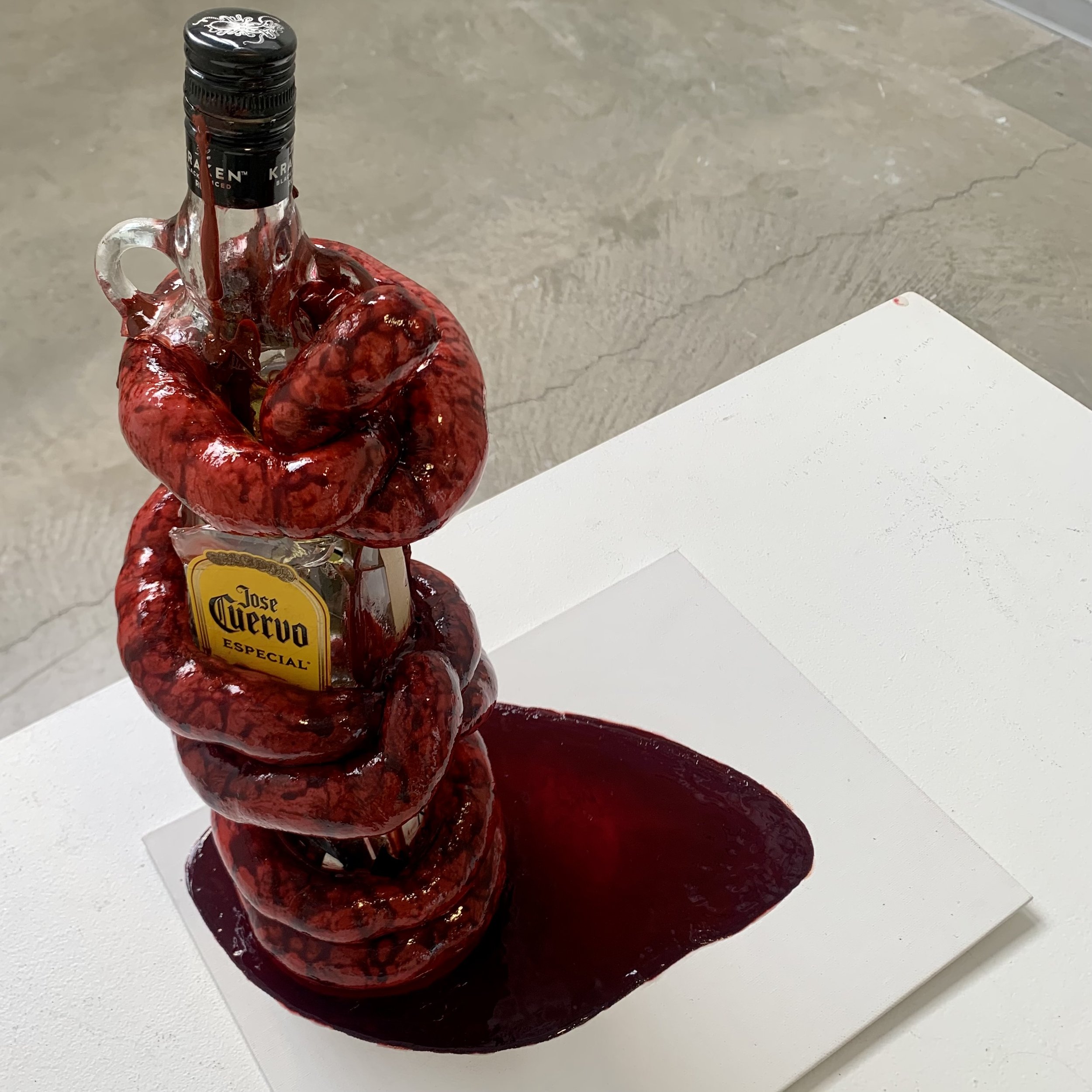 Suffocating, 2023. Glass, sausage casing, polyester fiber, acrylic paint, fake blood