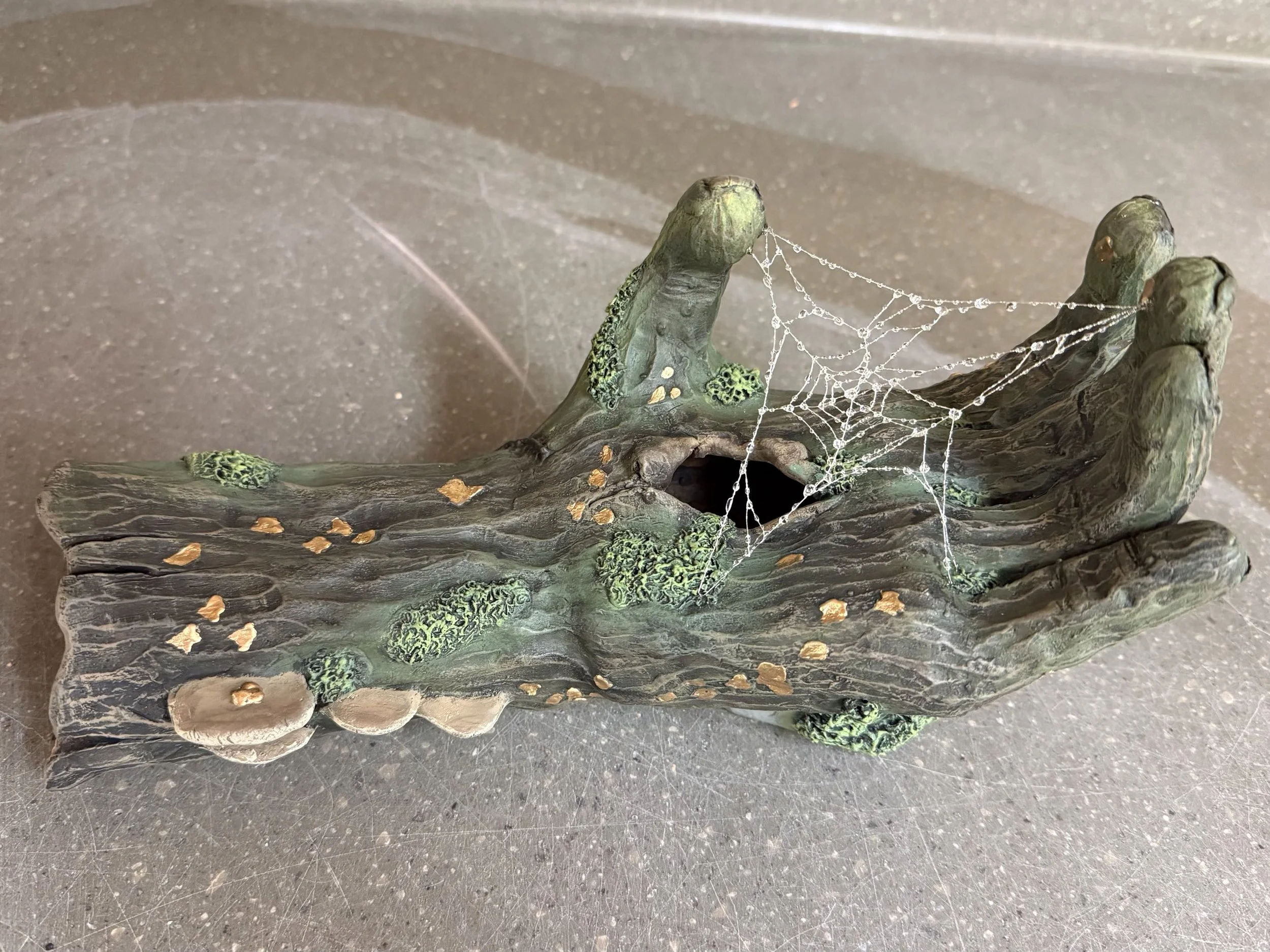 Hand That Holds, 2025, stoneware and scrylic paint, 6.5" x 10.5" x 5"