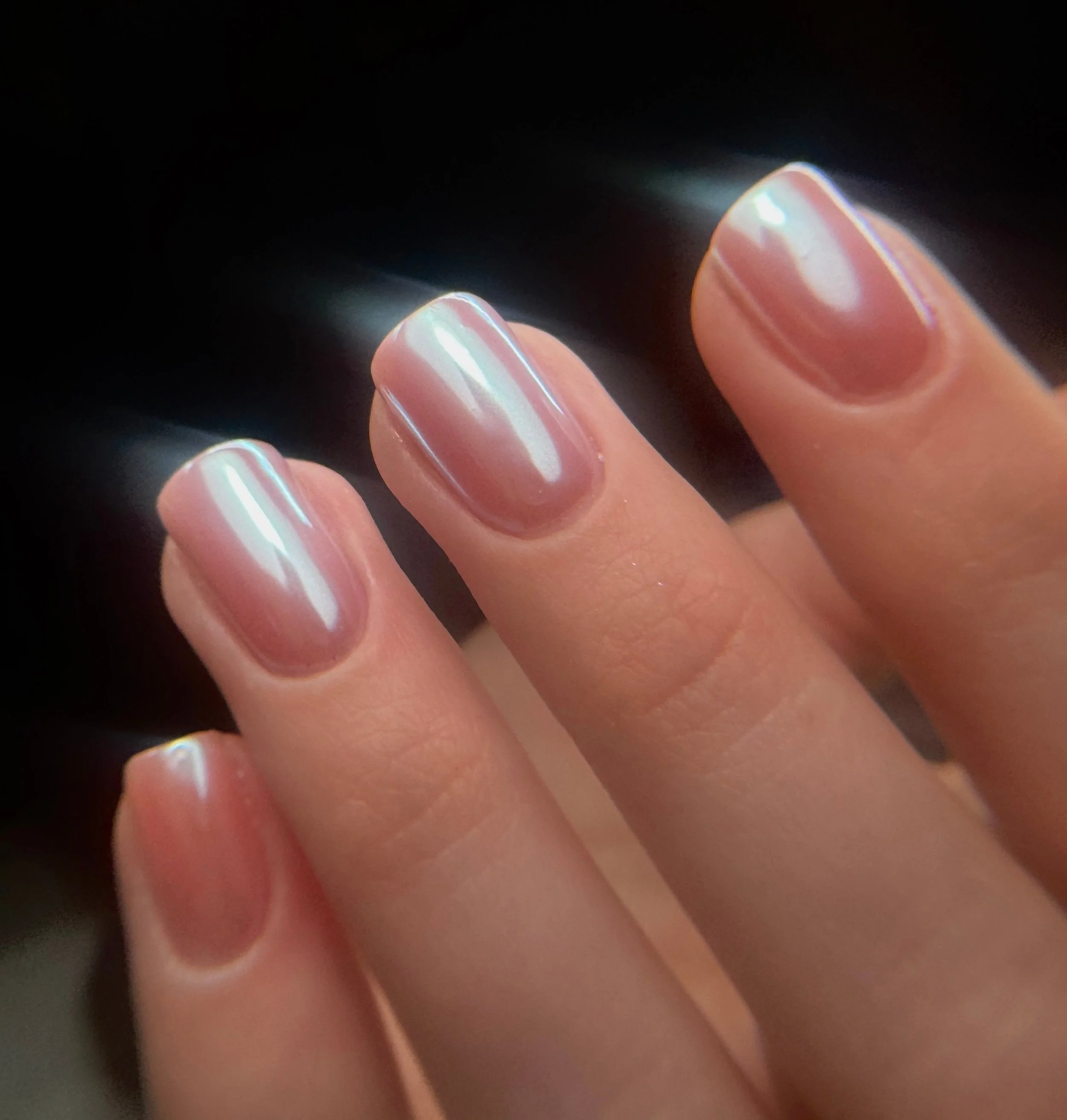 Close up of a very detailed Russian manicure with builder gel and chrome on top.