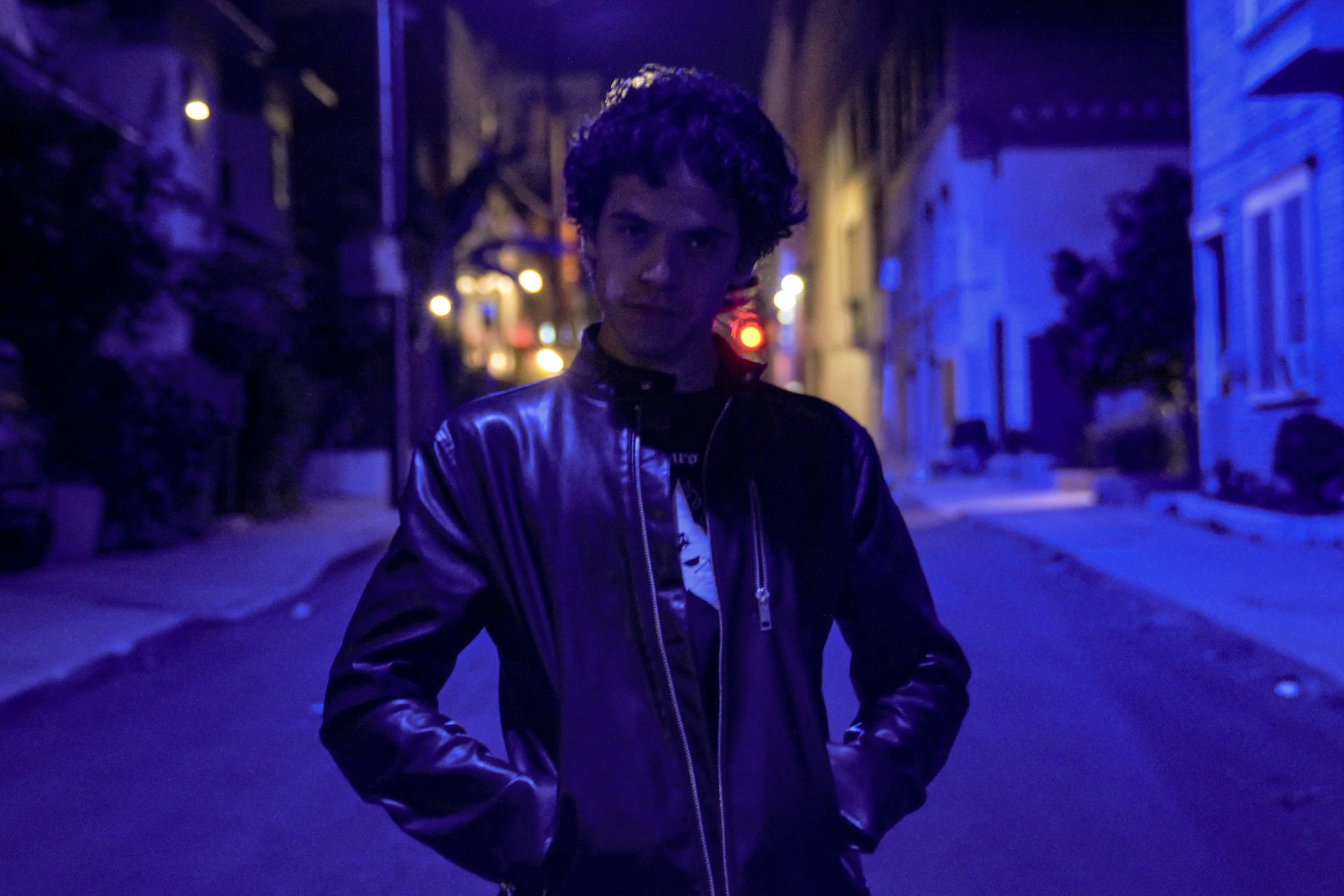 Daniel stares menacingly at the camera, poised for the perfect shot.