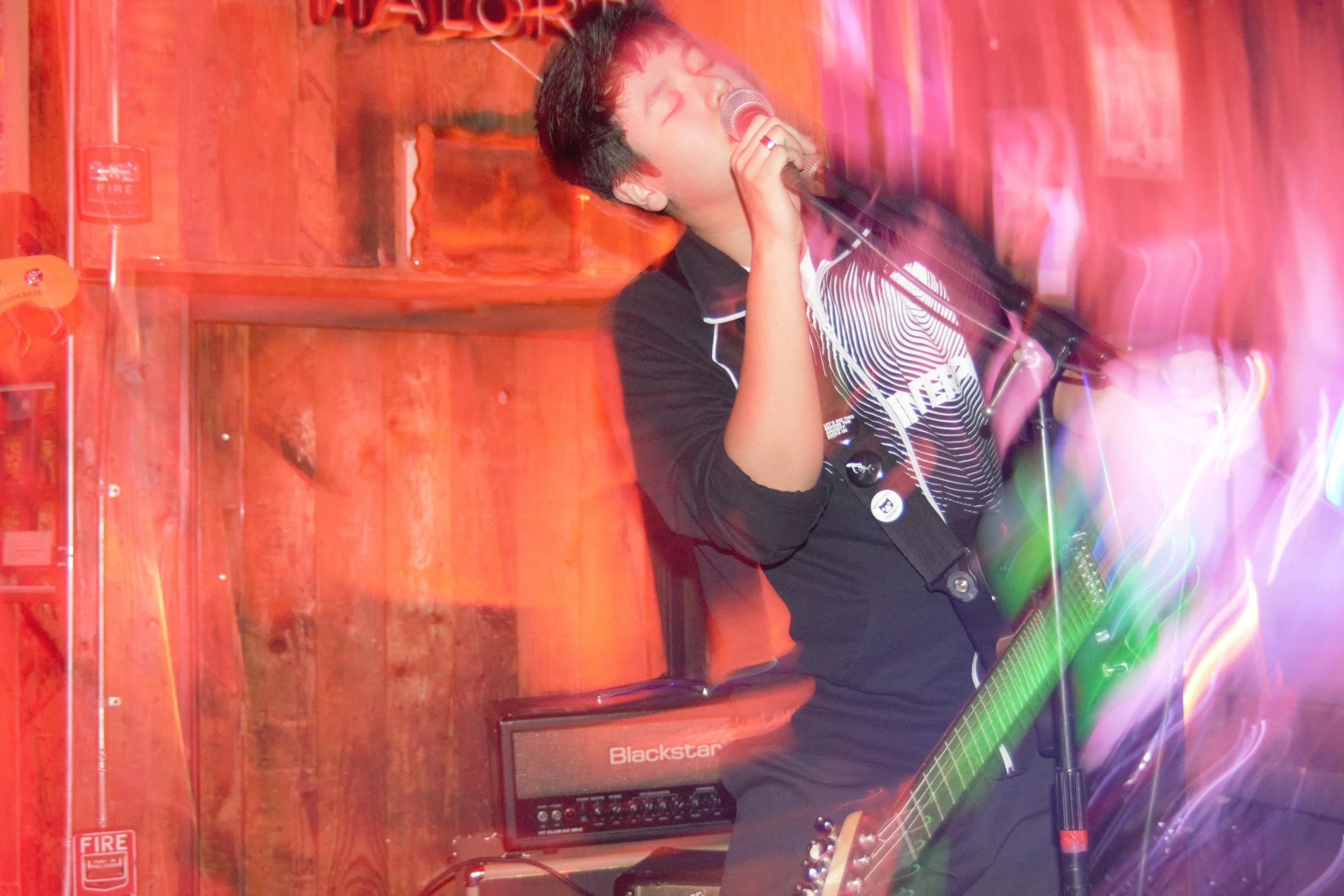 Drew sings while the stage becomes another blur.