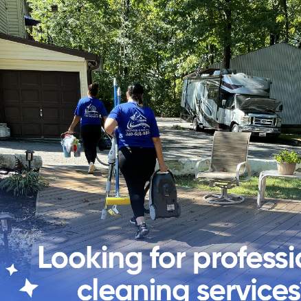 Two professional cleaners in matching blue uniforms walking toward an outdoor area with cleaning equipment, a residential garage, and a recreational vehicle, with text overlay advertising cleaning services.