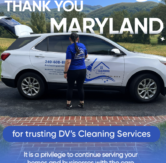 A woman in a blue jacket and black pants standing next to a silver SUV with a cleaning service logo on the door, outdoor setting with greenery and mountains in the background.