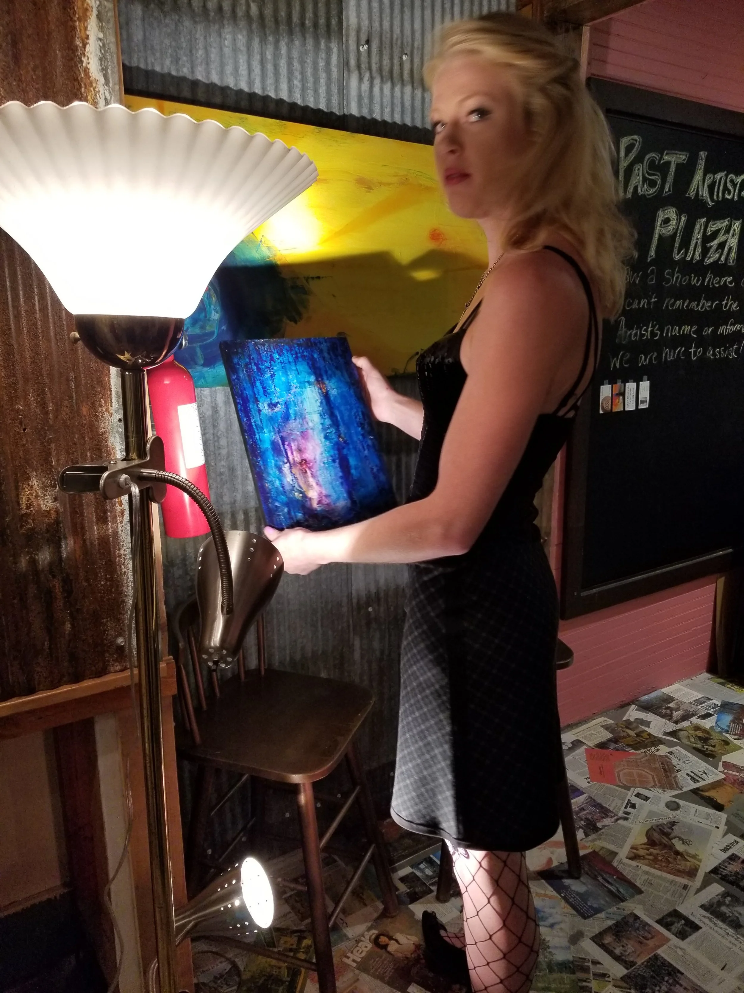 Proud collector holding a small piece at the old PiXfiZ gallery