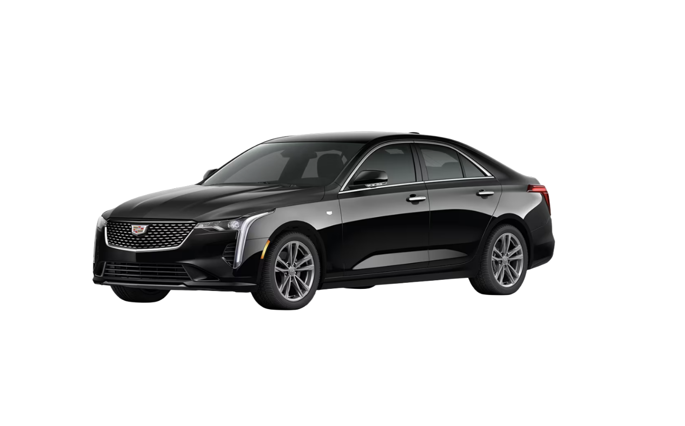 Black modern sedan car with silver accents and a badge on the front grille