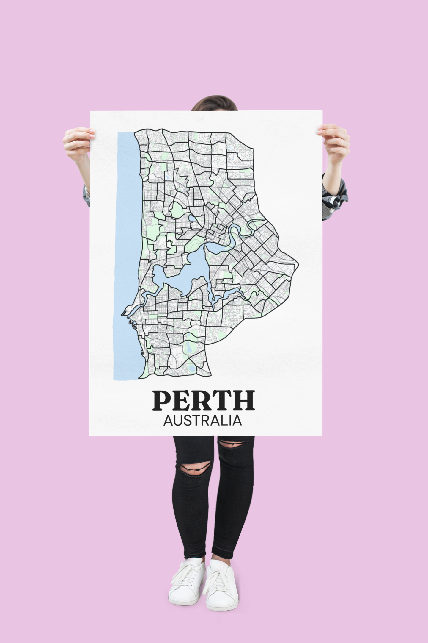 Unframed colour street map poster of Perth, Australia held up by a person against a pink background.