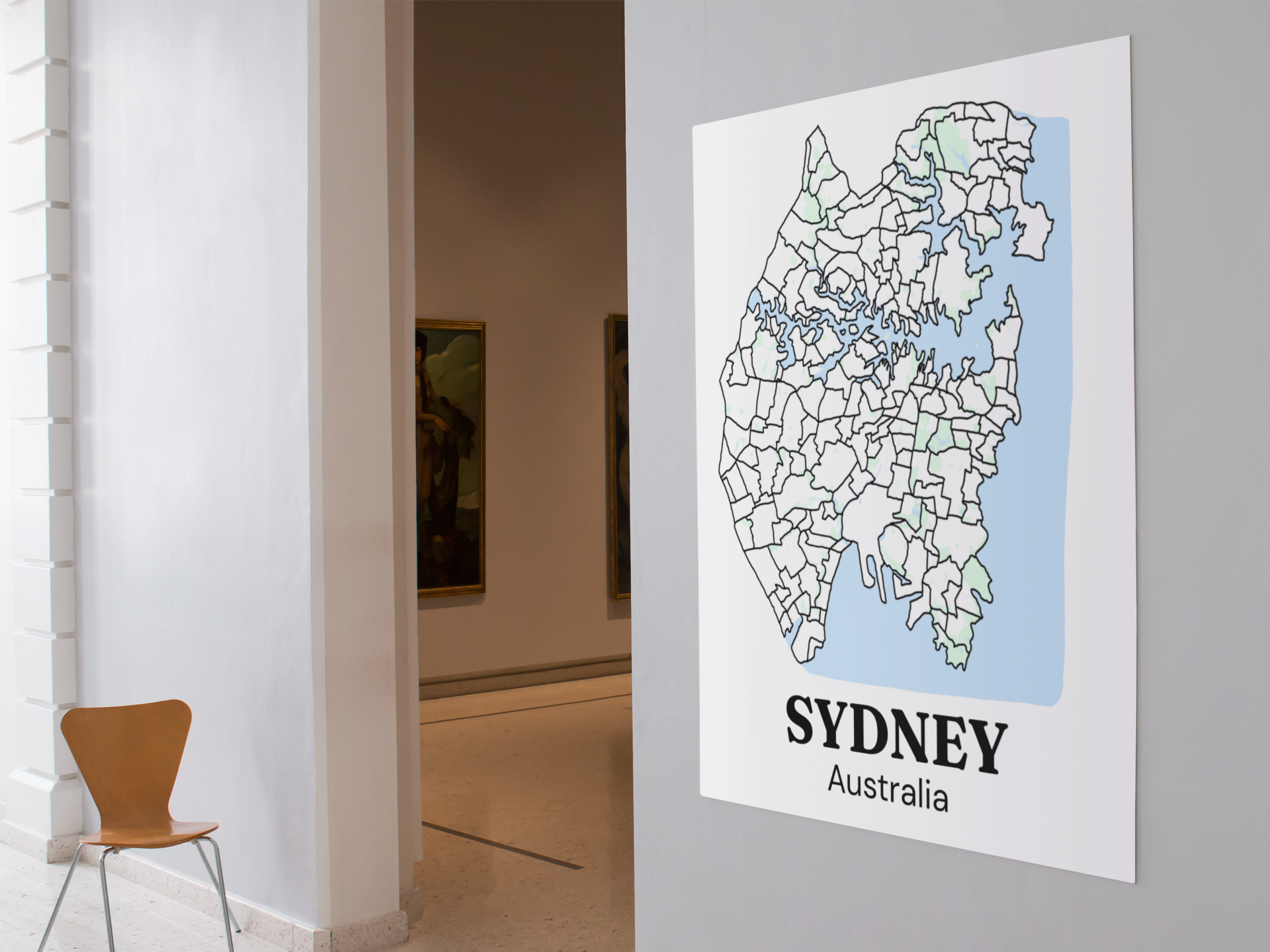 Large bare Sydney suburb map print, unframed, displayed on a gallery hallway wall, styled alongside classic framed artwork