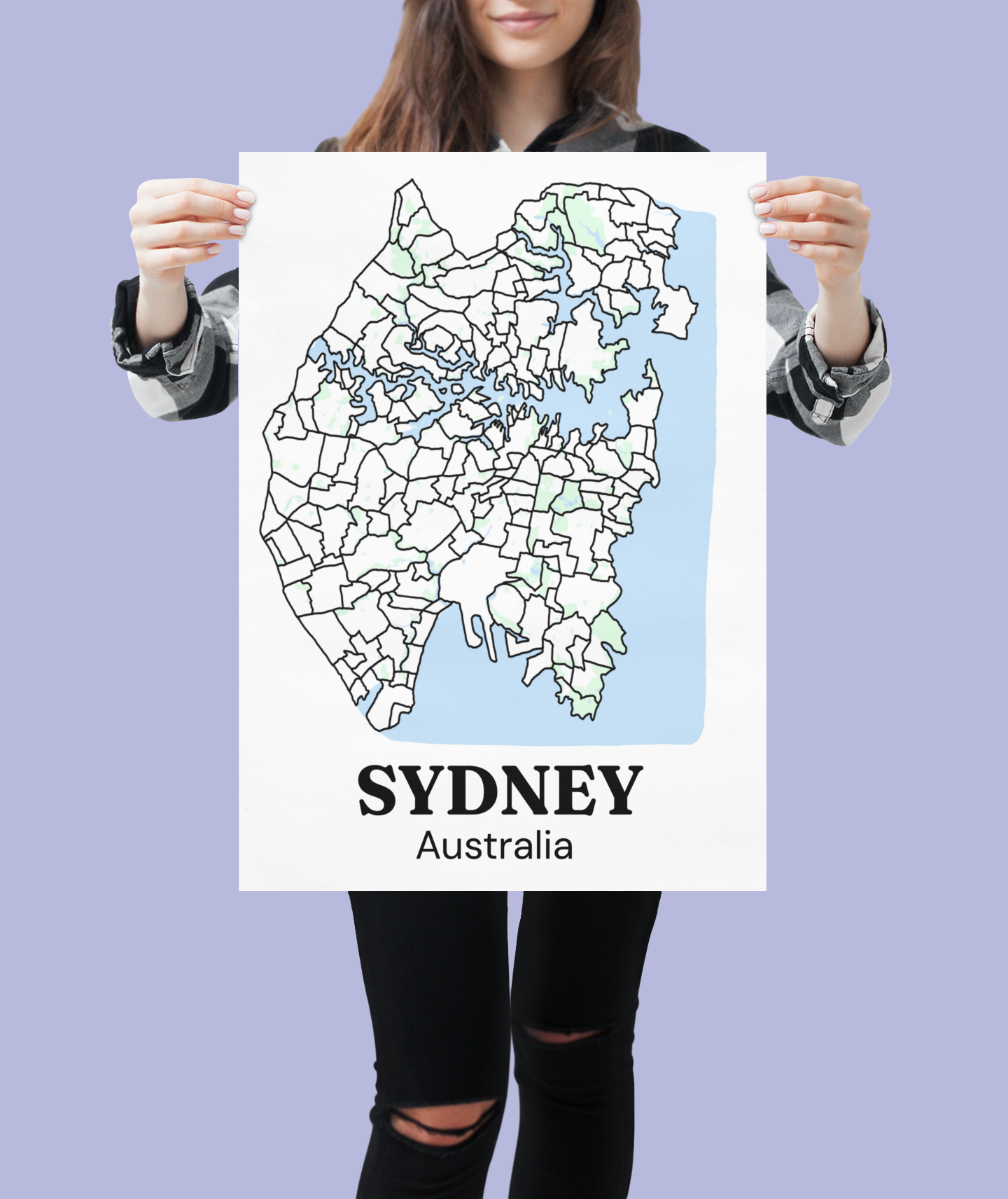 Person holding up a bare Sydney suburb map print, unframed, against a purple background, showing the full print size and detail
