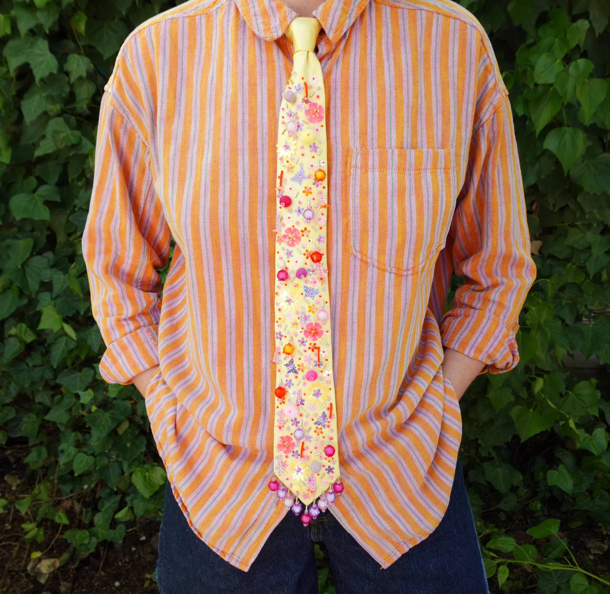 Hand-sewn embellishments on thrifted tie