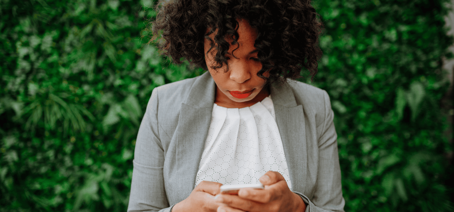 business lady looking at her phone
