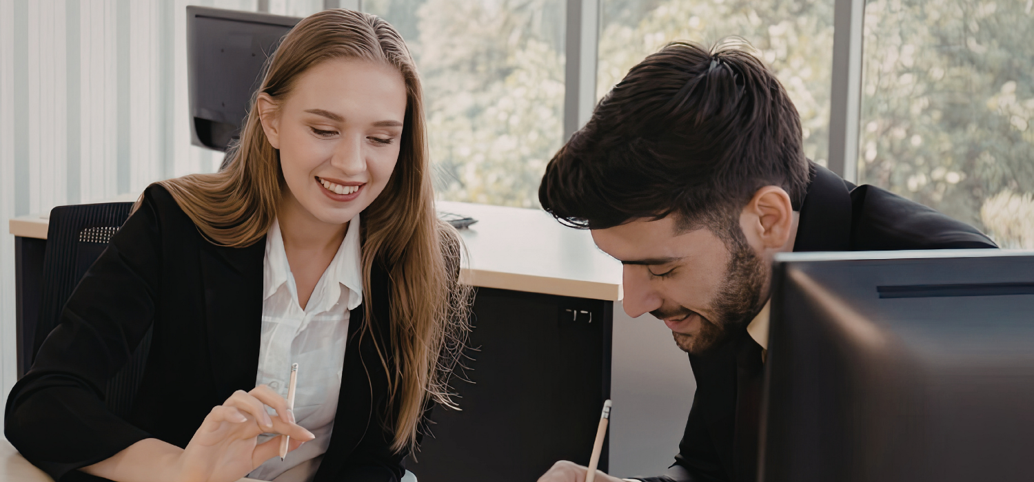 Girl and guy collaborating on a project