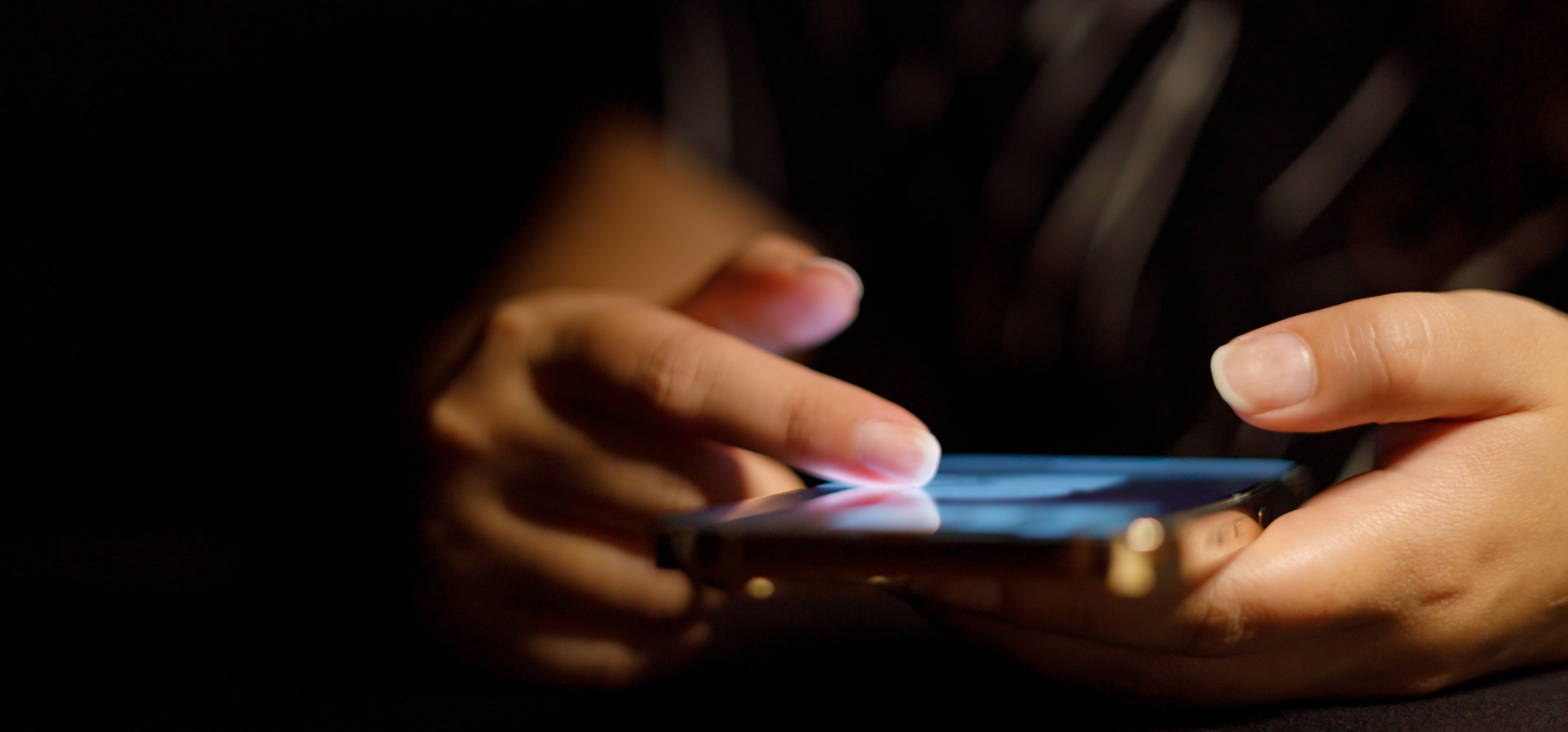 Hand scrolling through content on a smart phone