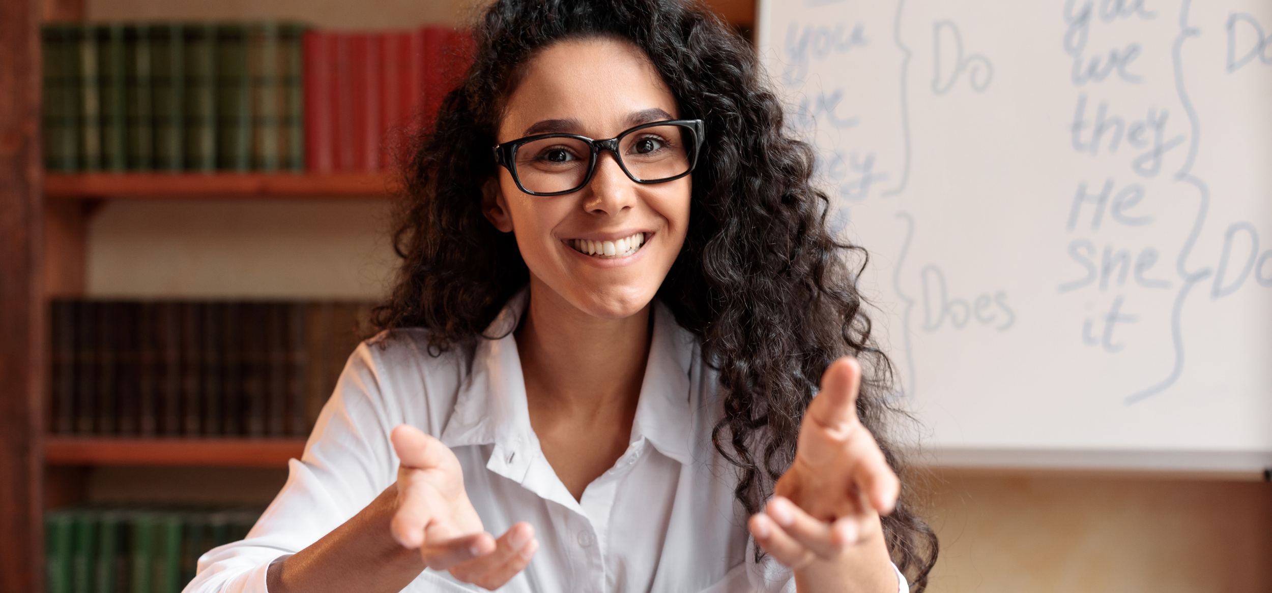 Brunette lady talking to camera and smiling
